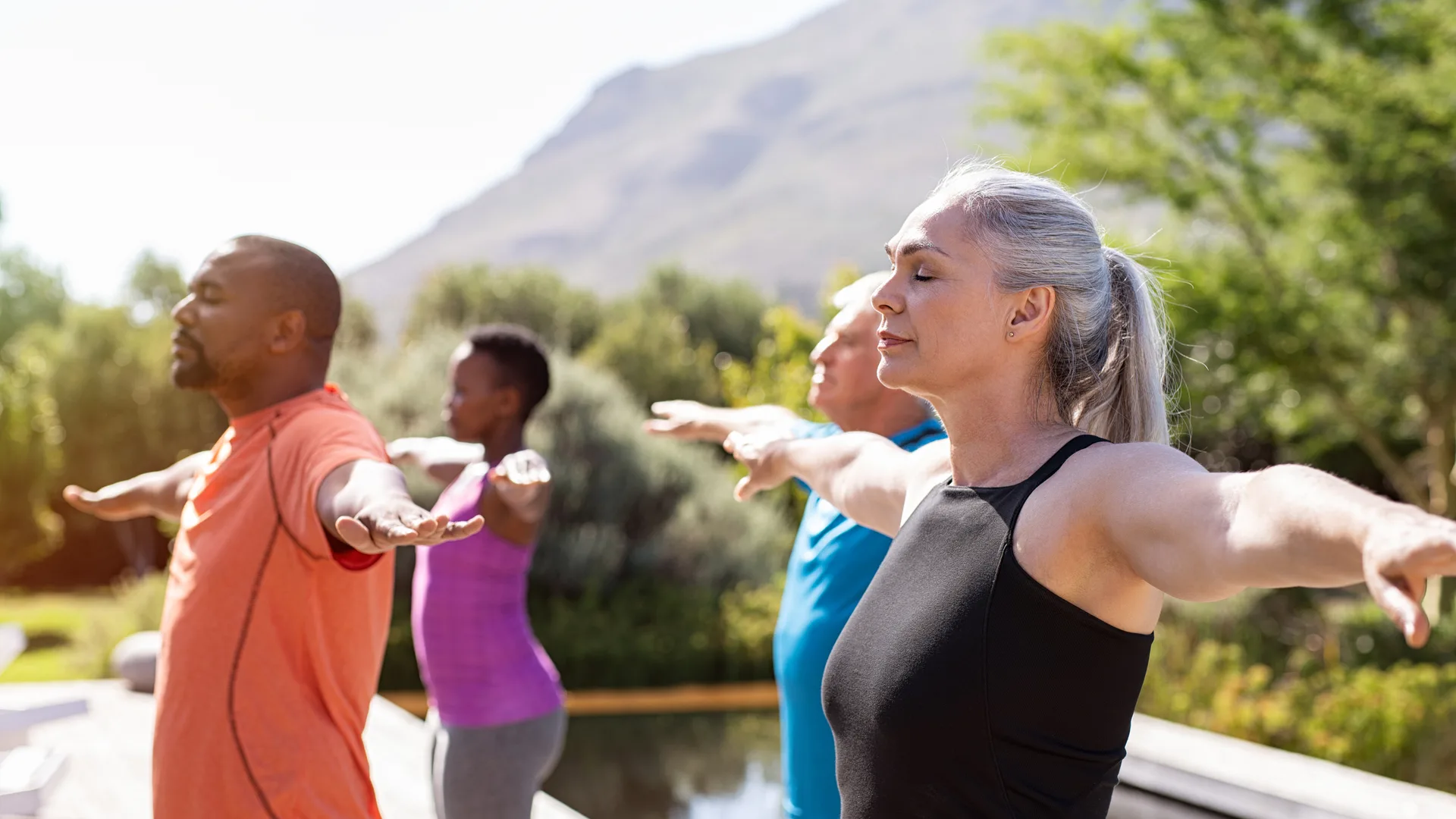 Group of middle aged men and women being mindful